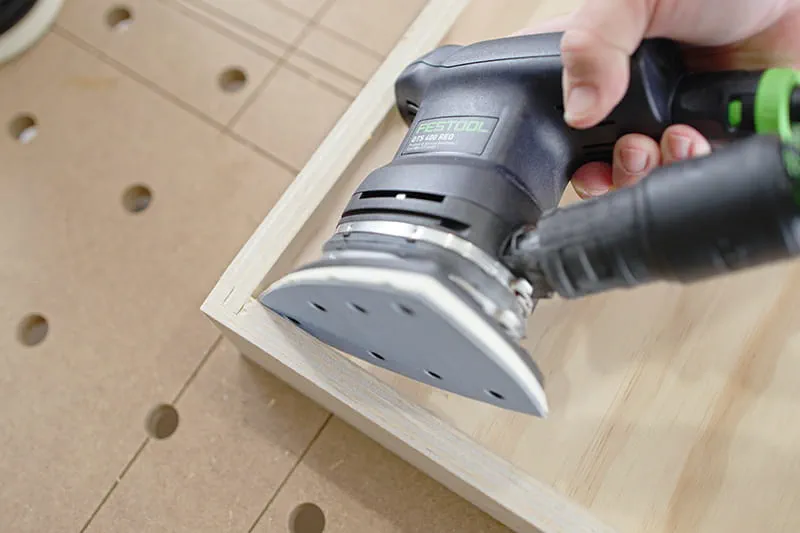 Sanding the corner of the drawer