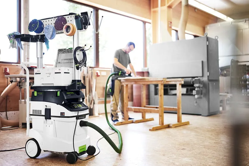 Dust Extractor with tool organization and worker sanding in background