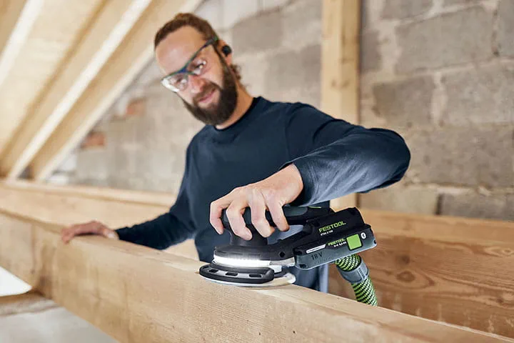 Tradesperson using a ETSC2 sander