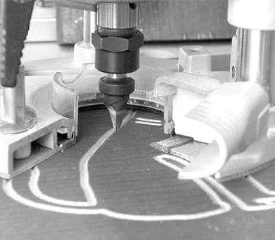 Rout pictures and letters into wood using the router