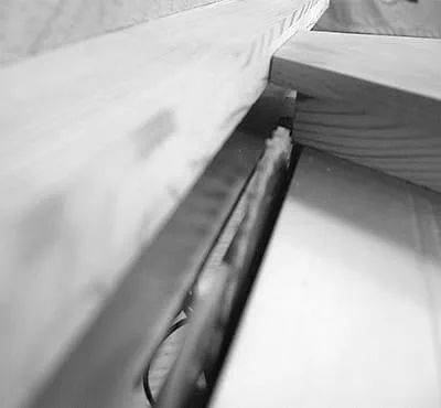 Pushing away the parallel side fence