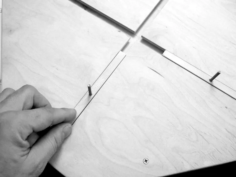 Pushing the guide rails into the dovetail grooves