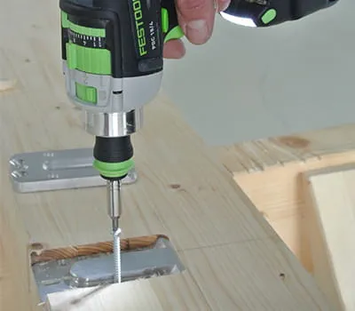 Attaching connector with screws