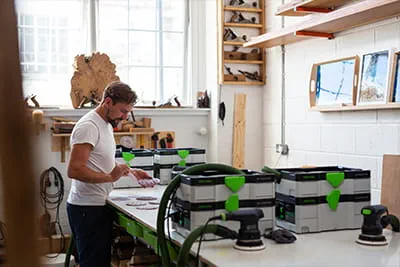 Richard Wagner preparing a workshop with dust extractors